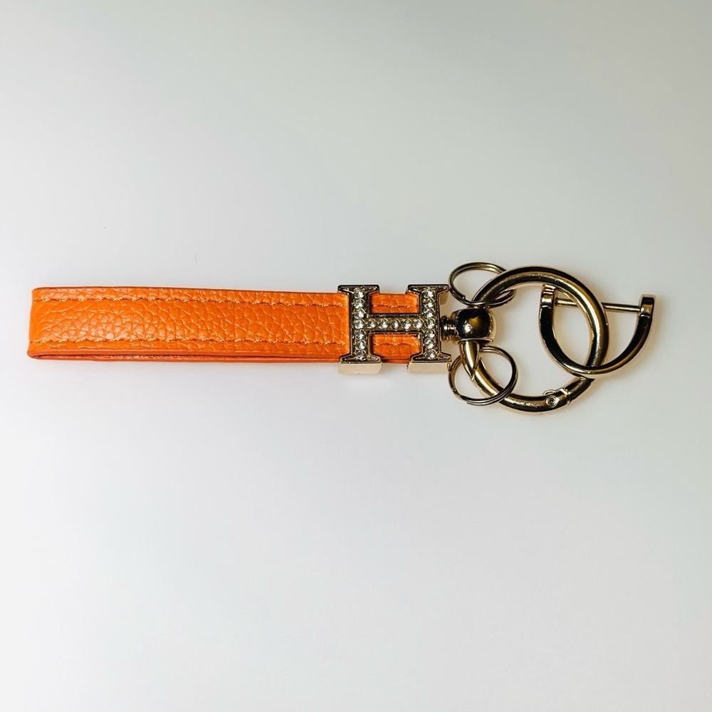 H Orange Leather Keychain with Gold Accents